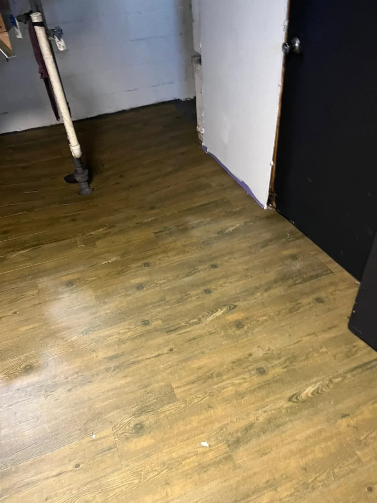 Basement Luxury Vinyl Plank Flooring Installation photo 3